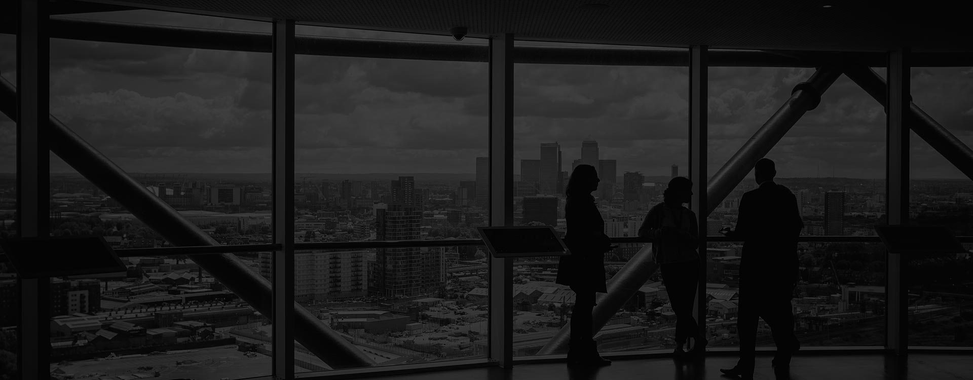 Silhouettes in front of cityscape